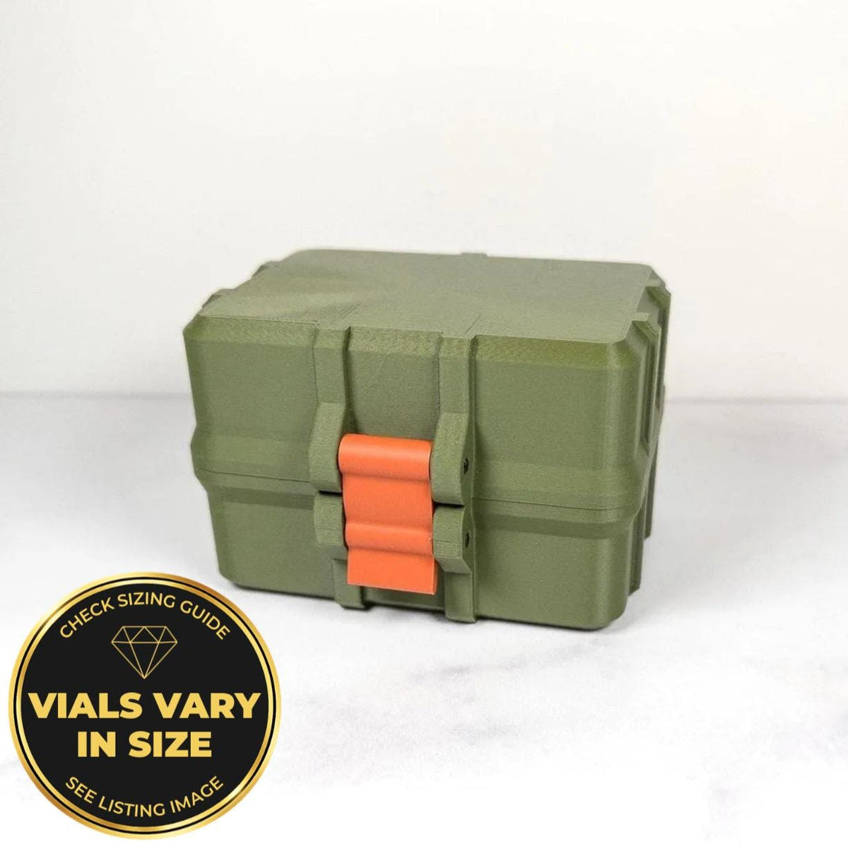 A green and orange toolbox with a red handle, sitting on a white surface.