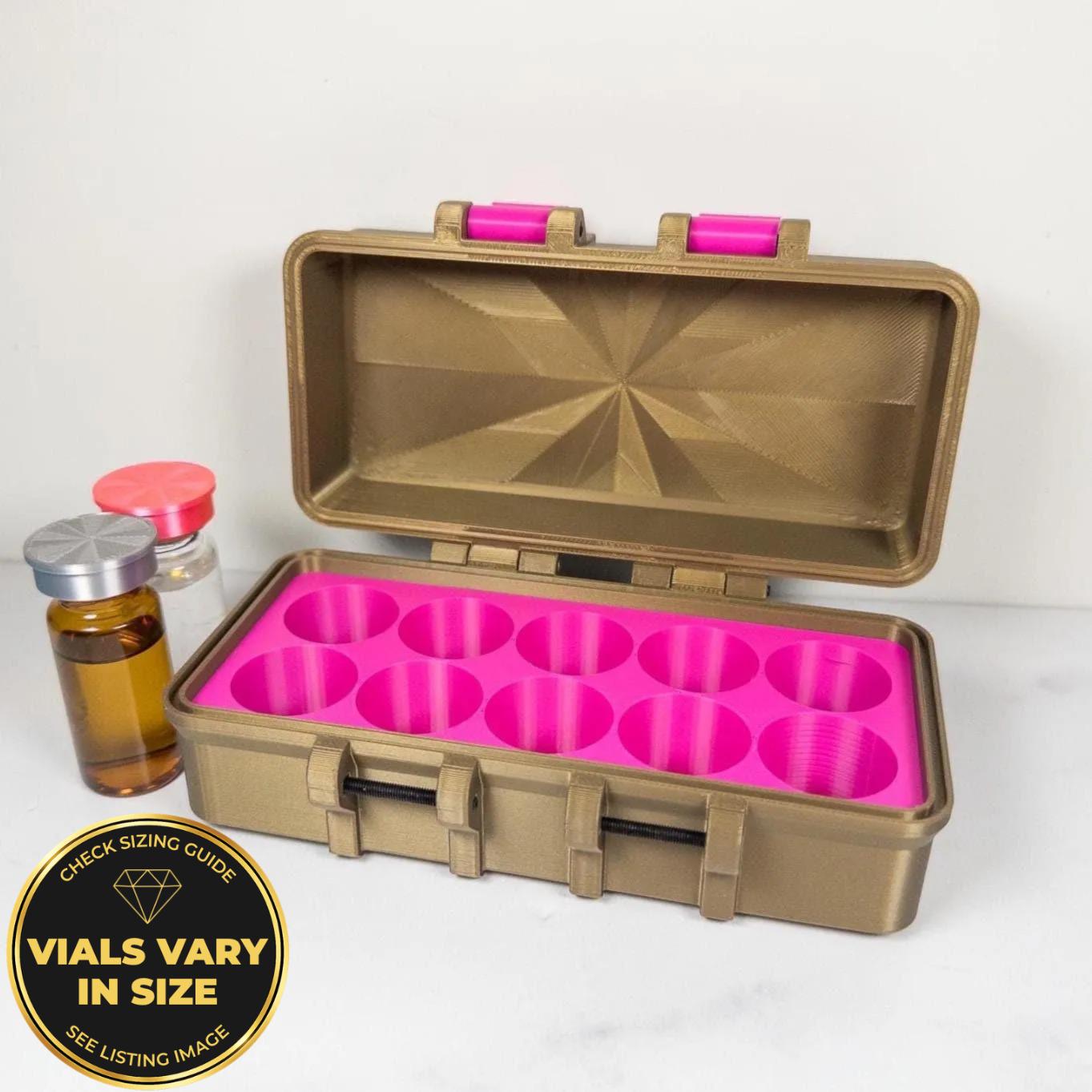 A gold-colored plastic container with a pink interior, containing nine small plastic cups or vials. There is also a small bottle of liquid next to the container.