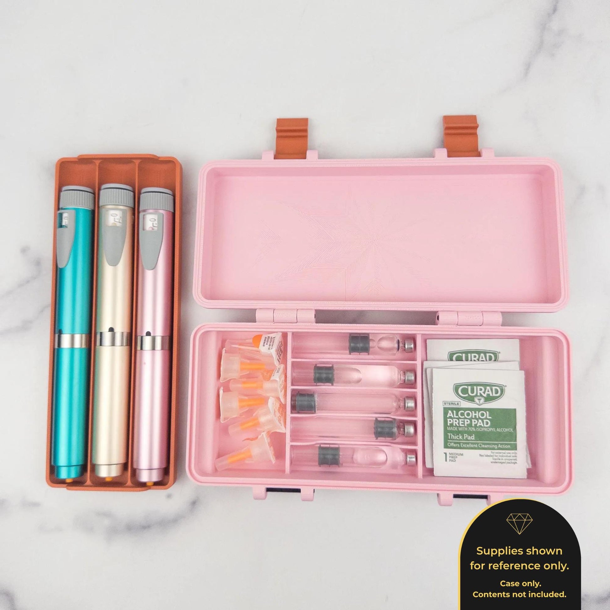A pink plastic container holding various medical supplies, including pens, alcohol pads, and a small packet of medication.