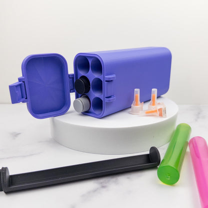 a purple container with a black lid, surrounded by various colorful plastic containers and tools on a white marble surface.