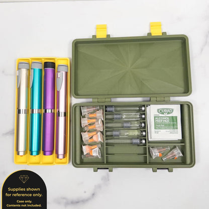 a green container with a yellow lid, containing various medical supplies such as pens, a syringe, and alcohol pads.
