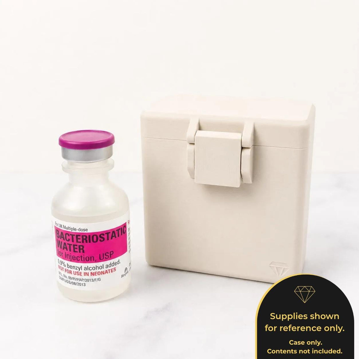 a bottle of Bacteriostat Water and a white container with a flip-top lid, placed on a white surface.
